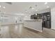 Spacious kitchen with stainless steel appliances, an island with pendant lighting, and a view into the dining and living areas at 148 Long Leaf Pine Dr., Conway, SC 29526