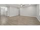 Large living room with light walls, modern lighting, woodgrain floors, and staircase at 148 Long Leaf Pine Dr., Conway, SC 29526