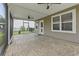 Relaxing screened-in patio with decorative concrete flooring and ceiling fans for outdoor comfort at 148 Long Leaf Pine Dr., Conway, SC 29526