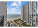 Balcony view of Landmark Resort, beach, and pool area on a sunny day at 1501 Ocean Blvd. S # 1249, Myrtle Beach, SC 29577