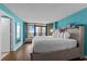 Relaxing bedroom with a king bed, balcony access, and light-toned furnishings at 1501 Ocean Blvd. S # 1249, Myrtle Beach, SC 29577