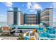 Landmark Resort featuring a waterslide, blue accents, and partial ocean view at 1501 Ocean Blvd. S # 1249, Myrtle Beach, SC 29577