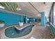 Inviting indoor hot tub area with tiled pool, lush potted plants, and calming blue decor for resort guests at 1501 Ocean Blvd. S # 1249, Myrtle Beach, SC 29577