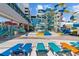 Bright outdoor waterpark area featuring colorful slides, splash zone and blue lounge chairs for relaxing by the pool at 1501 Ocean Blvd. S # 1249, Myrtle Beach, SC 29577