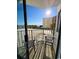 View from balcony with chairs and table overlooking the beach on a sunny day at 1605 S Ocean Blvd. S # 105, Myrtle Beach, SC 29577