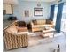 Cozy living room with comfortable seating and access to the balcony at 1605 S Ocean Blvd. S # 105, Myrtle Beach, SC 29577