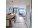 Open concept living space with a small dining area, living area and bed at 1605 S Ocean Blvd. S # 105, Myrtle Beach, SC 29577