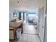 Open concept living space with a small dining area, living area and bed at 1605 S Ocean Blvd. S # 105, Myrtle Beach, SC 29577