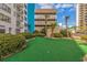 Outdoor mini golf area featuring lush greenery and landscaping around the building at 1605 S Ocean Blvd. S # 105, Myrtle Beach, SC 29577