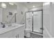 Bright bathroom with a white vanity, glass shower, and coastal decor creating a serene atmosphere at 191 Marley Blue Dr., Little River, SC 29566