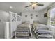 Bright bedroom featuring two beds with coastal themed decor and a privacy screen at 191 Marley Blue Dr., Little River, SC 29566
