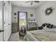 Bright bedroom featuring a cozy chair, ceiling fan, and view from the window at 191 Marley Blue Dr., Little River, SC 29566