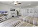 Upstairs bedroom featuring two beds with coastal themed decor, TV, and privacy screen at 191 Marley Blue Dr., Little River, SC 29566