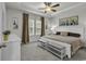 Bright bedroom with a tray ceiling, ceiling fan, neutral tones, and natural light creating a calm retreat at 191 Marley Blue Dr., Little River, SC 29566