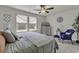 Serene bedroom featuring soft hues, cozy chair, and bright windows for a relaxing retreat at 191 Marley Blue Dr., Little River, SC 29566