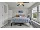 Calm bedroom featuring a comfortable bed, natural light, and charming nautical decorations at 191 Marley Blue Dr., Little River, SC 29566