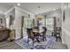 Bright dining room featuring wood table, stylish rug, and sliding doors to the outdoor space at 191 Marley Blue Dr., Little River, SC 29566