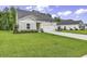 Charming single-Gathering home with well-manicured lawn and attached two car garage at 191 Marley Blue Dr., Little River, SC 29566