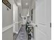 Inviting hallway with elegant decor, stylish console tables, and a welcoming atmosphere at 191 Marley Blue Dr., Little River, SC 29566