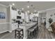 Spacious kitchen boasts a granite island, modern appliances, and stylish pendant lighting at 191 Marley Blue Dr., Little River, SC 29566