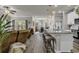 Open-concept living space with a kitchen island, plush seating, and ample natural light at 191 Marley Blue Dr., Little River, SC 29566
