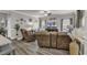 Relaxing living room with comfortable seating, wood floors, and stylish decor, creating a cozy atmosphere at 191 Marley Blue Dr., Little River, SC 29566