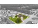Aerial view of a beautiful home showcasing its spacious lot, mature trees, and surrounding neighborhood at 196 La Patos Dr., Myrtle Beach, SC 29588