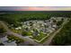 Great aerial view showing community with mature trees, lush landscaping and a large green space surrounding the homes at 196 La Patos Dr., Myrtle Beach, SC 29588