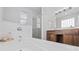 Bathroom showcasing a soaking tub, glass shower, and wood vanity with double sinks at 196 La Patos Dr., Myrtle Beach, SC 29588