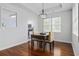 Dining area features wood floors, modern light fixture, and a view into kitchen at 196 La Patos Dr., Myrtle Beach, SC 29588