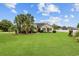 Charming home with mature palm trees, green lawn, and manicured landscaping creates great curb appeal at 196 La Patos Dr., Myrtle Beach, SC 29588