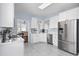 Bright kitchen features white cabinets, modern appliances, and a view into the dining area at 196 La Patos Dr., Myrtle Beach, SC 29588
