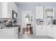 Well-equipped kitchen features white cabinets, stainless steel appliances, and modern finishes at 196 La Patos Dr., Myrtle Beach, SC 29588