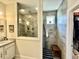 Modern bathroom showcasing granite countertops, a glass-enclosed shower, and a separate shower room at 200 Ponte Vedra Dr., Murrells Inlet, SC 29576