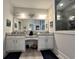 Bathroom featuring dual sinks, granite countertops, a large mirror and glass shower at 200 Ponte Vedra Dr., Murrells Inlet, SC 29576