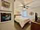 Cozy bedroom featuring a decorative ceiling fan, a wooden bed frame, and stylish wall art at 200 Ponte Vedra Dr., Murrells Inlet, SC 29576