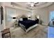 Large primary bedroom with a king bed, neutral walls, carpet, and two bedside tables with lamps at 200 Ponte Vedra Dr., Murrells Inlet, SC 29576