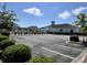Community clubhouse, parking lot, and landscaped entrance at 200 Ponte Vedra Dr., Murrells Inlet, SC 29576