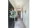 Welcoming entryway with light gray walls, white trim, a decorative rug, and a stylish pendant light at 200 Ponte Vedra Dr., Murrells Inlet, SC 29576