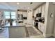 Well-lit kitchen with granite countertops, white cabinetry, stainless steel appliances, and open layout at 200 Ponte Vedra Dr., Murrells Inlet, SC 29576