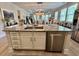Spacious kitchen island with granite countertop, stainless steel dishwasher, and white cabinets at 200 Ponte Vedra Dr., Murrells Inlet, SC 29576