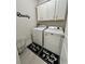 Well-lit laundry room boasts pristine washer and dryer and cute mat that says Wash, Dry, & Fold at 200 Ponte Vedra Dr., Murrells Inlet, SC 29576