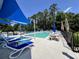 Community outdoor pool with chairs, tables, and lounge chairs for the use of residents at 200 Ponte Vedra Dr., Murrells Inlet, SC 29576