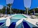 Outdoor community pool with lounge chairs and tables for residents to relax and enjoy the sunshine at 200 Ponte Vedra Dr., Murrells Inlet, SC 29576
