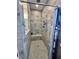 Tiled shower with a built-in bench, rainfall shower head, and recessed niche for toiletries at 200 Ponte Vedra Dr., Murrells Inlet, SC 29576
