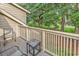 Cozy balcony with table and chairs, perfect for enjoying the outdoors with a beautiful yard view at 201 Westleton Dr. # 10-I, Myrtle Beach, SC 29572