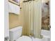 Bathroom with a tiled shower, white toilet, and a towel rack to the left at 201 Westleton Dr. # 10-I, Myrtle Beach, SC 29572