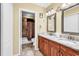 Bathroom showcasing double sinks, a vanity, granite countertops, and tile flooring at 201 Westleton Dr. # 10-I, Myrtle Beach, SC 29572