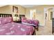Bedroom featuring two twin beds, tile flooring, and a view into the hall at 201 Westleton Dr. # 10-I, Myrtle Beach, SC 29572