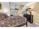 Well-lit bedroom featuring a queen sized bed, black furnishings, and a ceiling fan at 201 Westleton Dr. # 10-I, Myrtle Beach, SC 29572
